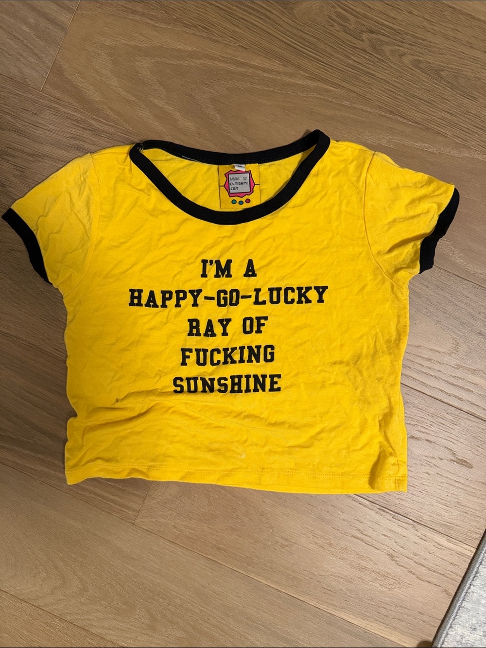 omighty Yellow Crop Tee with Black Trim and Graphic Text